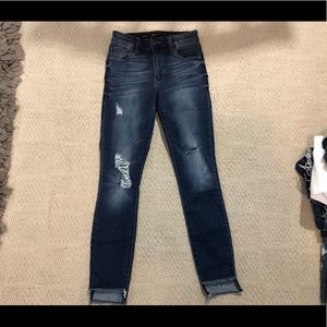 Blue distressed skinny jeans